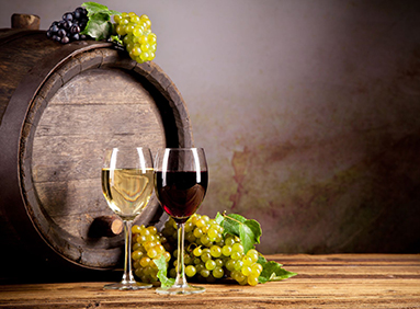 wine glasses, grapes and wine barrel